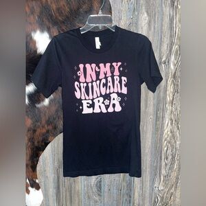 Bella canvas size small black tshirt with pink ombré graphic print nwot skincare